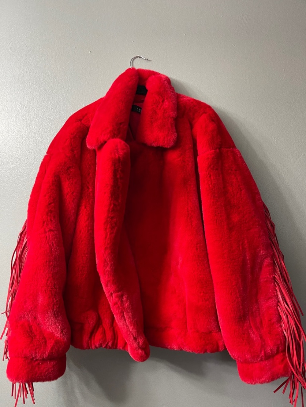 AKIRA Label Time To Shine Fringe Faux Fur Coat is made from a plush faux fur